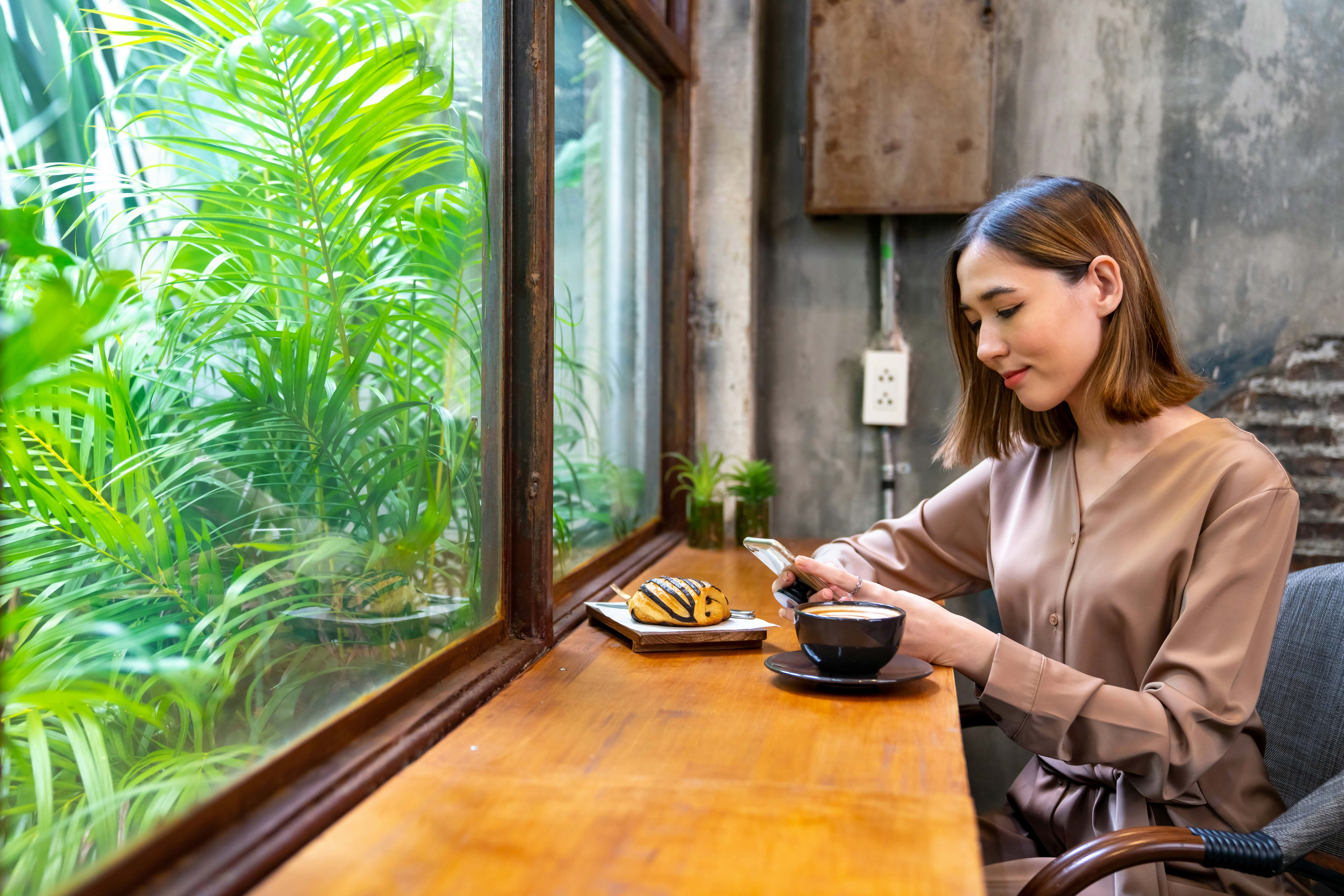 introvert woman coffee shop window seat